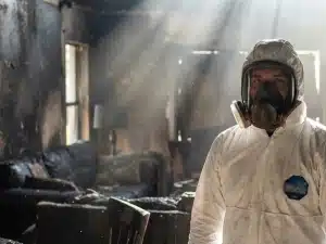 Inspector checks for structural safety following a Florida house fire near Tampa.